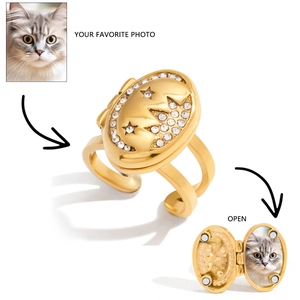 Detailed close-up of 18K gold locket ring with moon and star design for custom photos