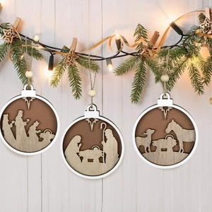 Three wooden nativity scene ornaments with jute ropes hanging against a festive background