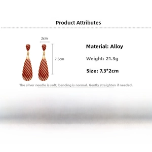 Detail view of retro red and gold zebra-striped teardrop earrings with dimensions info