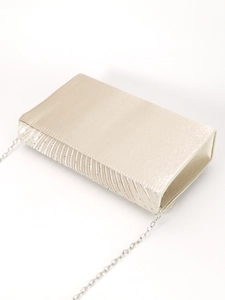 Detail of champagne satin evening clutch with pleated edges and sparkling rhinestones