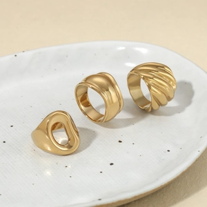 Minimalist gold irregular texture rings and croissant style band in polished stainless steel