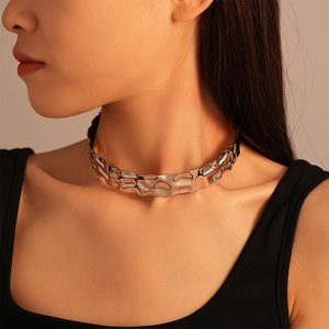 Detail of silver irregular ripple metal choker featuring unique liquid metal texture on neck