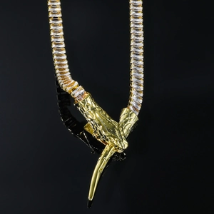 Luxurious gold snake pendant necklace with shimmering rectangular cubic zirconia stones