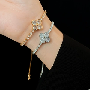 Detailed view of adjustable four-leaf clover bracelets with shimmering zircon stones