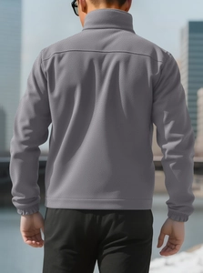 Rear view of grey fleece jacket showing back tailoring and premium material texture