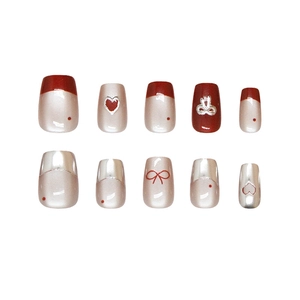 Handmade cat-eye press-on nails with red bow and heart patterns in short square shape