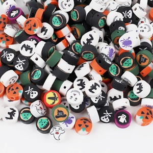 Macro shot of Halloween polymer clay beads with pumpkin and ghost patterns for DIY jewelry