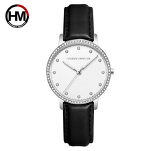 Detail of Hannah Martin watch featuring a silver crystal bezel and black leather strap