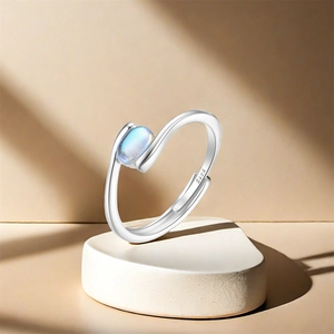 Close-up of S925 sterling silver ring with oval moonstone and adjustable band