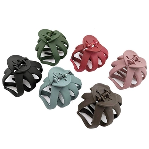 Matte octopus hair claws in six assorted colors including deep green and burgundy on white background