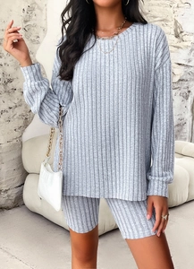 Detail showing the gray ribbed knit texture of the long sleeve top and shorts set