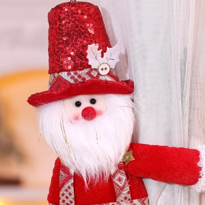Detail of Santa Claus curtain tieback with red sequins and soft white plush beard