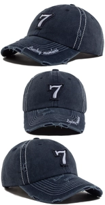 Detail of vintage baseball cap with number 7 embroidery and distressed brim stitching