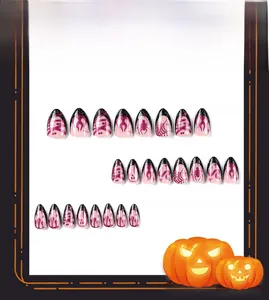 Detail of almond Halloween press-on nails with purple glitter flame and spider web patterns