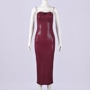 Detail of burgundy snakeskin texture dress with lace trim and black bow accent