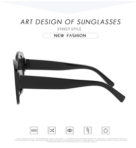 Side view detail of retro oval sunglasses showing sleek black resin frame and UV protection