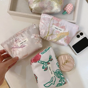 Mini floral jacquard organizer pouches with zipper and Simple Wish logo tag