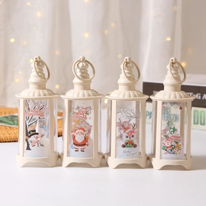 Set of 4 cream white Christmas LED lanterns with festive prints and warm lights