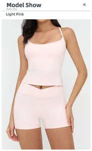 Detail of pale pink yoga set featuring a cross-waist design and side pockets on high shorts