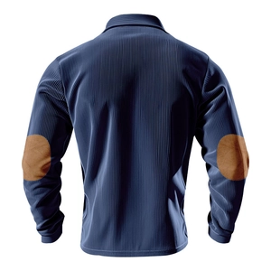 Detail of navy corduroy polo shirt featuring brown elbow patches and vertical ribbed texture