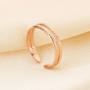 Detail of rose gold double-layer adjustable ring with smooth and twisted texture
