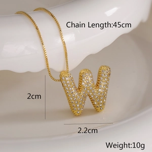 Macro detail of gold letter W pendant with cubic zirconia and box chain measurements