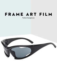 Macro shot of futuristic black wraparound sunglasses with artistic inner frame cutouts
