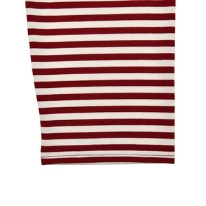 Detailed macro view of knitted striped cuffs with precise stitching on red and white T-shirt