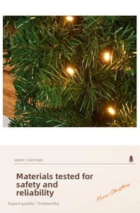 Detail of warm yellow LED fairy lights woven into green artificial pine needles for Christmas