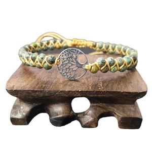 Handmade woven wrap bracelet with African turquoise beads and silver tree of life charm