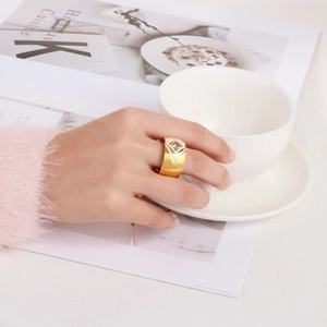 Exquisite wide gold geometric ring with zircon worn by a model in a lifestyle setting