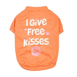 Close-up of bright orange summer pet t-shirt with I Give FREE Kisses print and heart motif