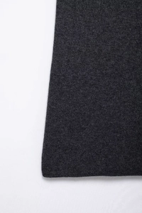 Detailed close-up showing the soft texture and fine knit of the dark gray diamond fabric