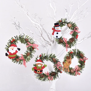 Christmas wreath pendants with Santa, snowman, elk, and bear figures on pine rings