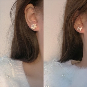 Elegant camellia flower and bow knot pearl stud earrings with gold trim and white enamel