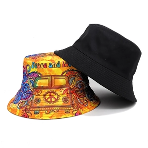Classic black and artistic yellow bucket hats with hippie peace symbols and graffiti bus
