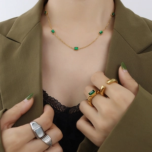 18K gold necklace and rings set with square green emerald cubic zirconia stones