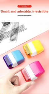 Detailed close-up of privacy roller stamps in blue, yellow, and pink for identity protection