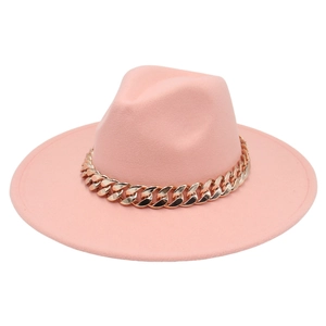 Detail of pink wide brim fedora hat featuring a decorative thick gold acrylic chain