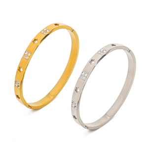 Hollow star bangle set in gold and silver finish with micro-inlaid rhinestone accents