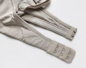 Detail of adjustable triple-row back hook closure on seamless ice silk backless bra
