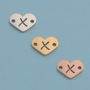 Three 12mm stainless steel heart pendants in silver, gold, and rose gold finishes