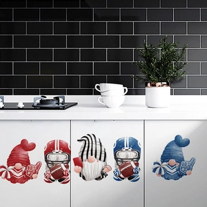 Detail of cute football gnomes stickers applied on modern white kitchen cabinets