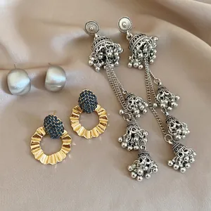Detailed set of 3 elegant earrings featuring silver tassels and blue crystal gold hoops