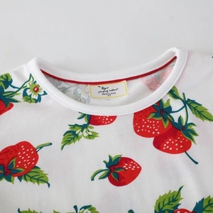 Girls long sleeve white knit dress with red strawberry print and ribbed crew neckline