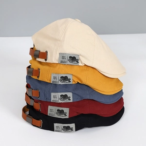 Adjustable street style canvas beret hats in various colors with leather strap detail