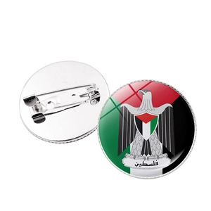Detail of Palestine national emblem badge featuring metal back and safety pin fastener