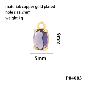 Macro detail of purple oval zircon pendant with 18K gold plated copper frame 9x5mm