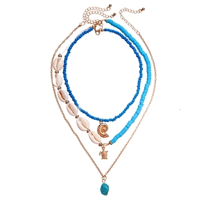 Three-piece bohemian necklace set with blue beads, sea turtle and conch pendants