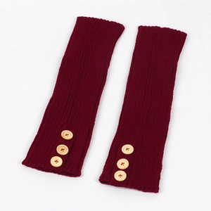 Close-up of ribbed knit texture and decorative wood buttons on wine red leg warmers